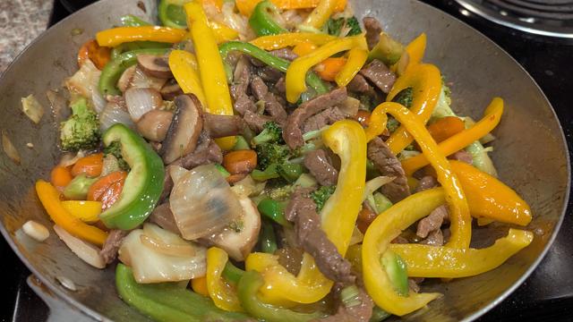 Picture of the veggies combined with the beef and mushrooms. A brown sauce has been added that I also made with garlic, fresh green onion, and some red pepper flakes
