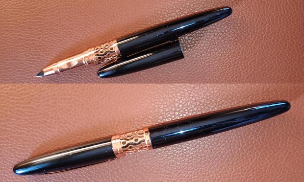 The oddball Wilknd pen I purchased on a whim four months ago. Two shots of the pen: capped and uncapped, on a faux leather background.