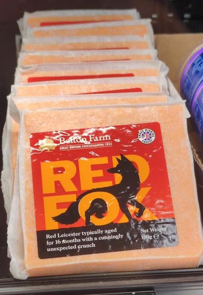 A photo of cheese in packaging called Red Fox.