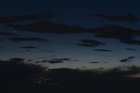 Scattered clouds add some texture to the evening sky in late twilight.

Jupiter is the brightest object. Mercury is below and right of Jupiter.

Castor and Pollux are in the right half of the frame.

See the second graphic for a finder chart of this image.