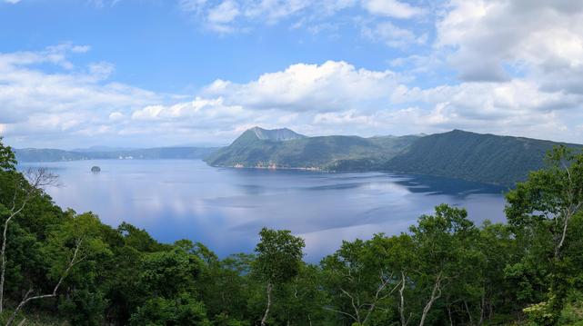 Lake Mashup, a massive body of water in a steep crater, with a small island.