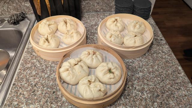 Picture of all 3 streamer baskets after steaming. The buns have doubled in size from steaming. They aren't all sealed, but they are all edible