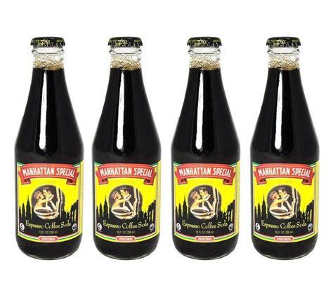 Four bottles of bubbly black liquid with a standard crown cork bottle cap. The label shows a couple dressed for the roaring 1920s in a circle. Behind the circle is a silhouette of the Manhattan skyline. Above is a ribbon logo with the name "Manhattan Special". Small text under the images says "espresso coffee soda"