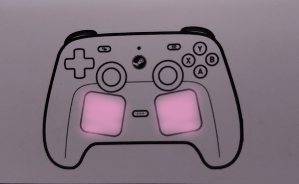 Photo of the steam controller drawing from the steam controller Health and Safety, Maintenance, Regulatory and Limited Warranty & Agreement Information booklet but the trackpads have been digitally spray-painted pastel pink to emulate blushing