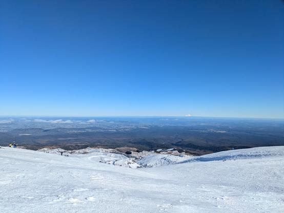 Actually pretty icy snow on Turoa under a clear sky. Taranaki Maunga is visible in the distance!
