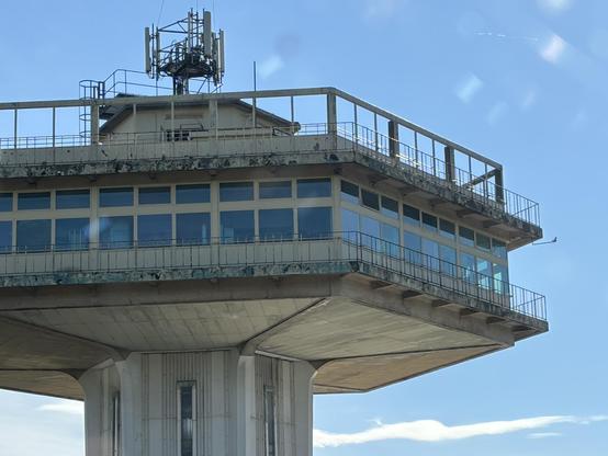 Looking up at the empty top section of the brutalist hexagonal tower at Lancaster (Forton) Services on the M6.