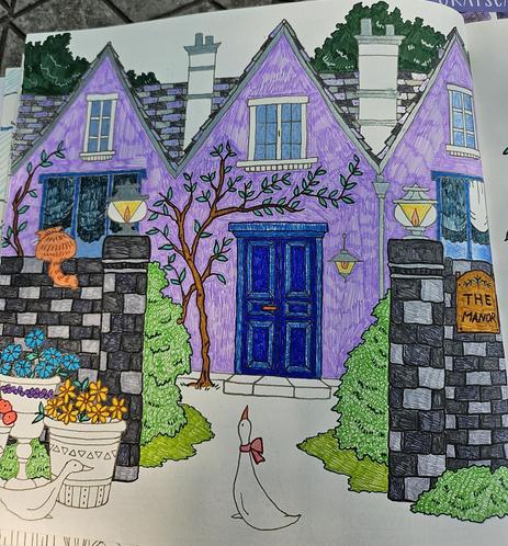 A coloring page with a big purple house that has woody vines climbing along it. There is a patterned stone wall in front with an orange cat sitting on top. Three pots of flowers are along one side of the wall and two white farm ducks are on the front path.