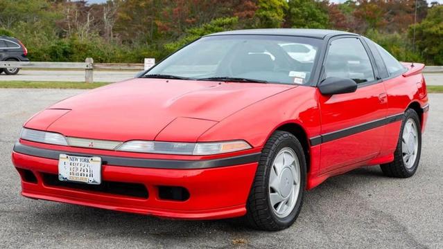 A first generation Mitsubishi Eclipse, red