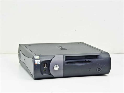 Showing a mid 2000s flat mini tower PC in a dark grey clamshell style case in its side