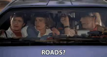 a group of people sitting in a car with the words roads written on the side