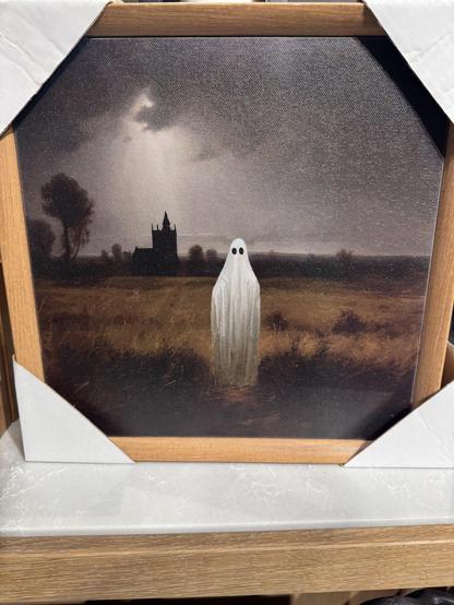 Small painting of a ghost standing in the middle of a field and looking ahead at the viewer. The ghost looks like a typical ghost with a white sheet with two black eye holes draped over a human form. 

Behind them in the distance is a castle, and the sky is overcast, dark, and threatening to rain.