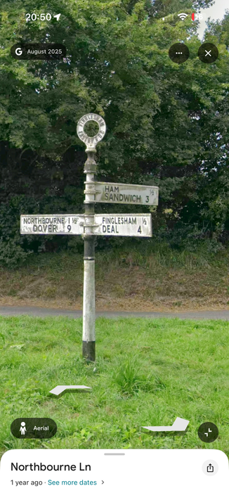 An old English signpost situated at the junction of three roads. It has signs pointing in three directions indicating the destinations to be found.

The topmost one, amusingly, lists two destinations:

HAM
SANDWICH 

The full sign reads (distances are in miles)

First direction:
NORTHBOURNE 1 1/2
DOVER 9

Second direction:
HAM 1/2
SANDWICH 3

Third direction:
FINGLESHAM 1/2
DEAL 4